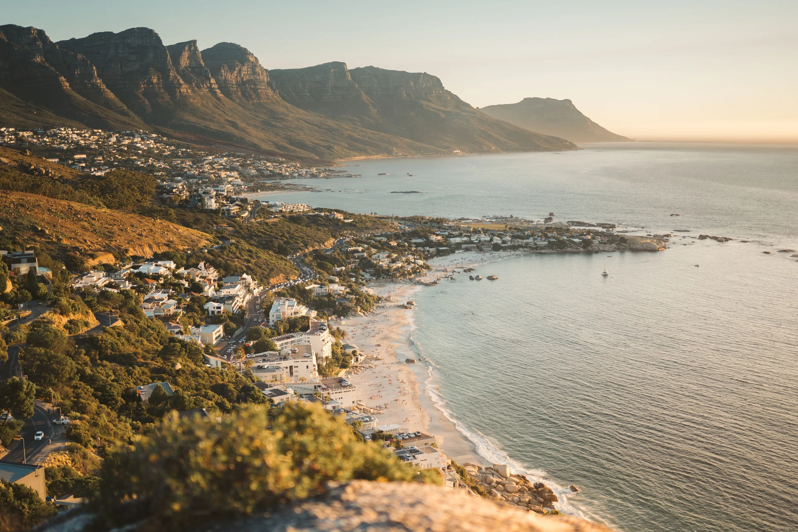 Camps Bay and the Twelve Apostles above Cape Town's Atlantic coast at golden hour