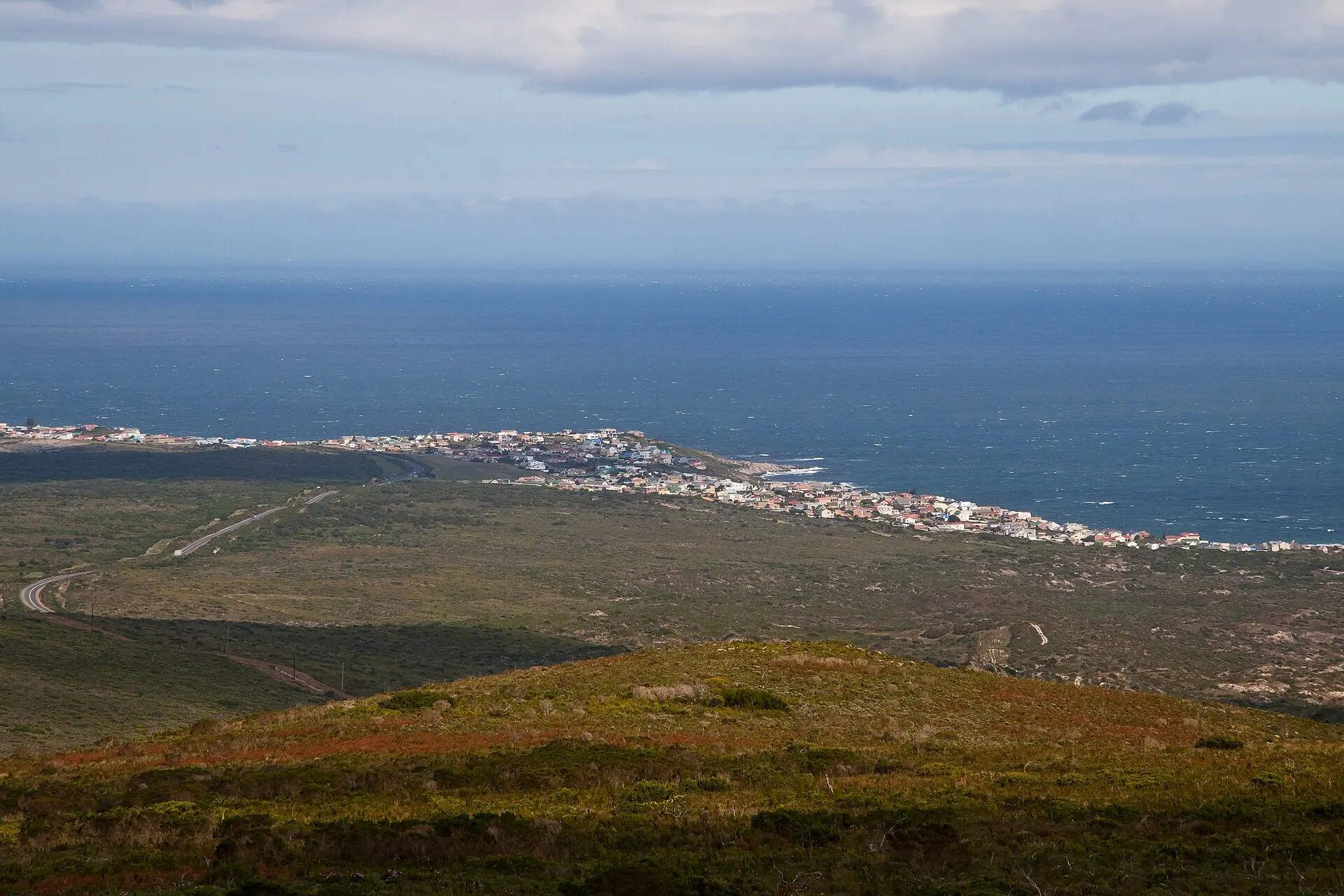 Fynbos-covered hills of the Grootbos reserve looking out over De Kelders and the sea