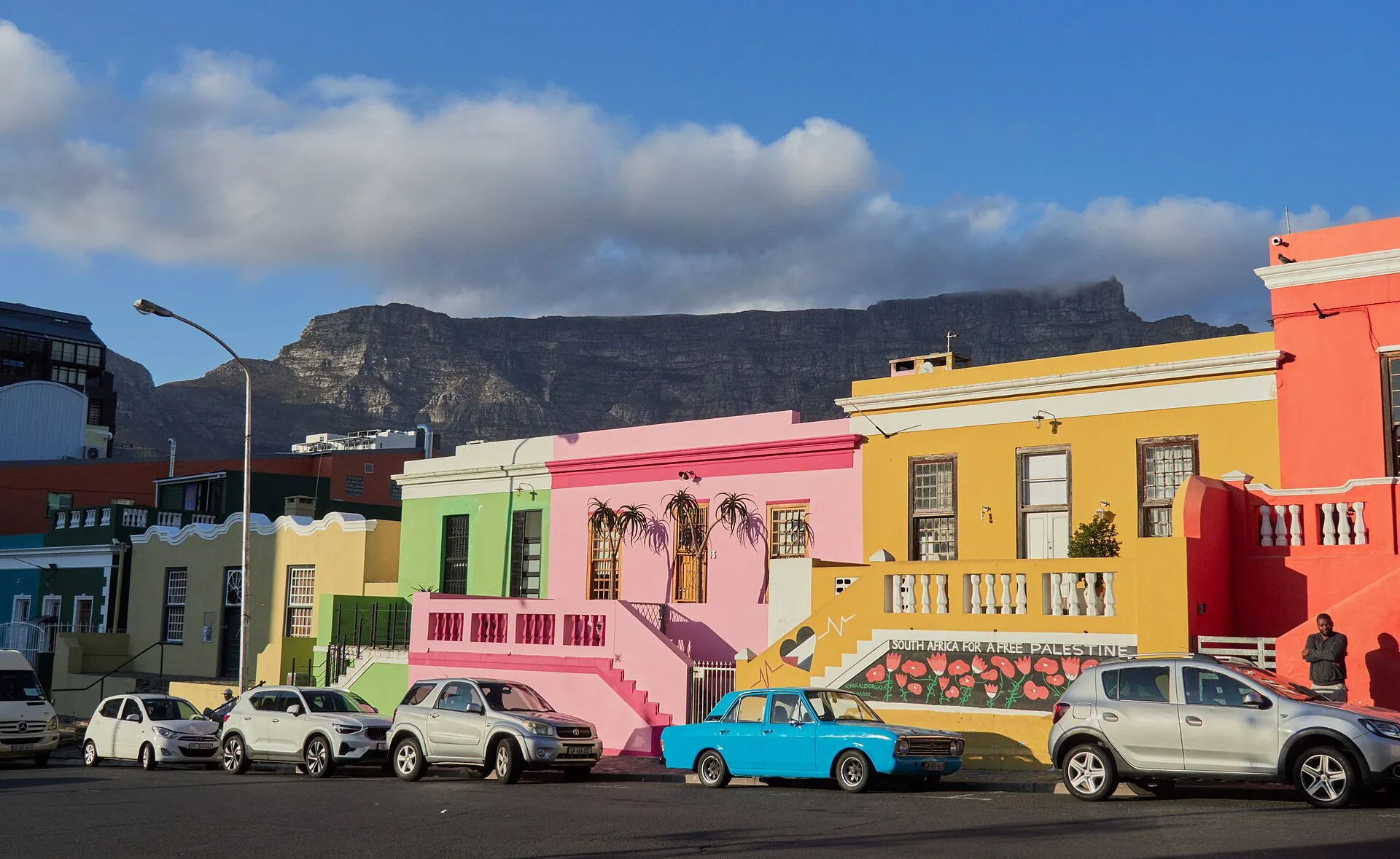Colourful Bo-Kaap houses in Cape Town with Table Mountain behind