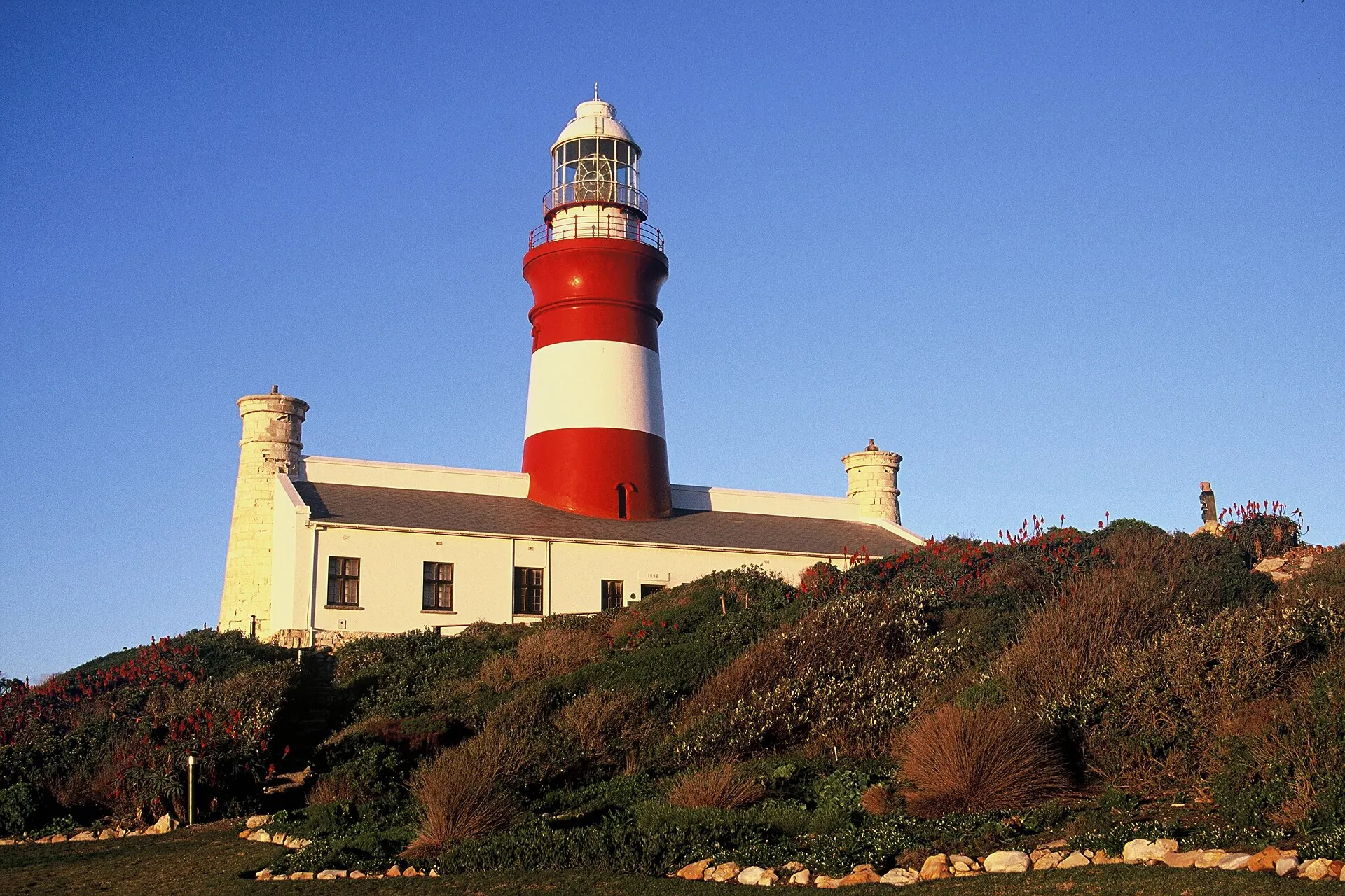 The red-and-white Cape Agulhas Lighthouse at the southern tip of Africa